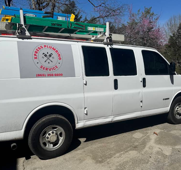A white van with express plumbing services written on the side