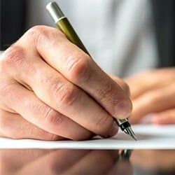 Business — Businessman Signing a Document in York, PA