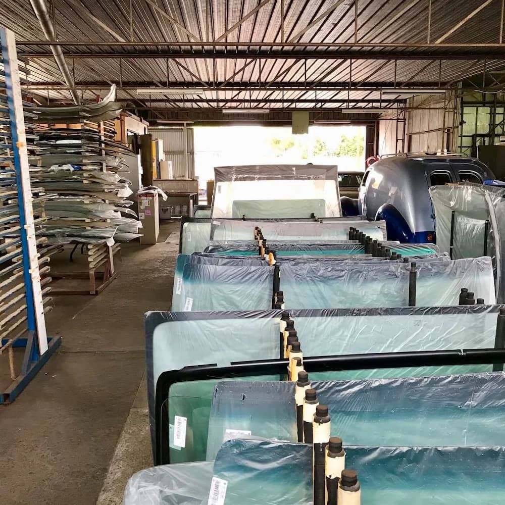 A Warehouse Filled With Lots Of Pieces Of Glass — Petrena Windscreens In Oakey, QLD