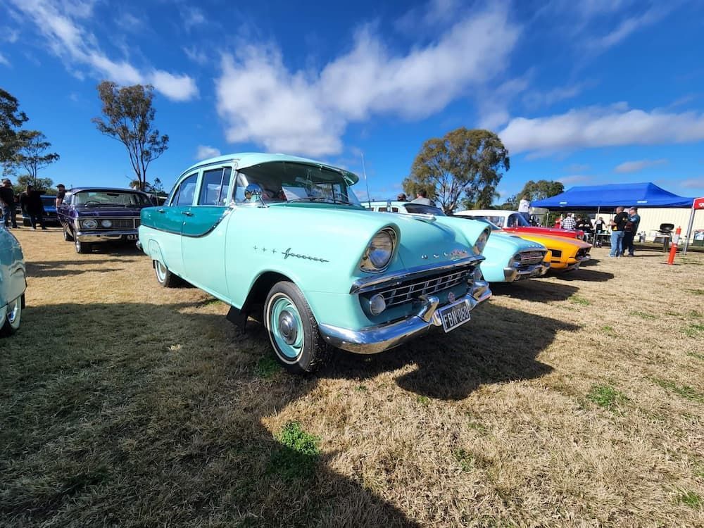 A Row Of Old Cars Are Parked In A Field — Petrena Windscreens In Pittsworth, QLD