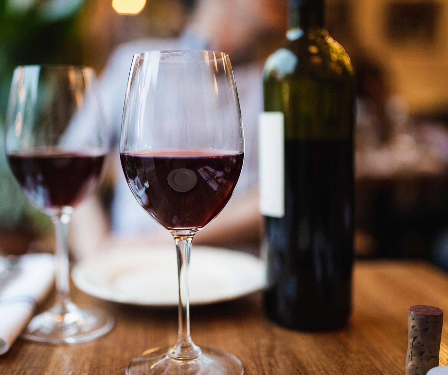 Bottle and Two Glasses of Wine on Table