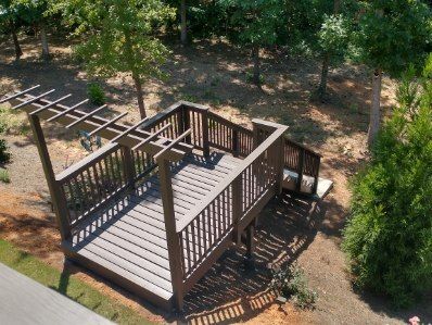 Sandy surface with wave-like patterns and long shadows, bathed in warm light.