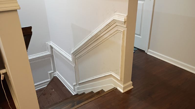 Aerial view of a winding river flowing through a dense, green forest.