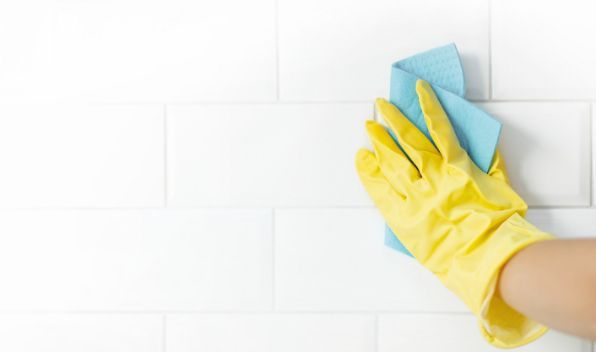 Ongoing cleaning of bathroom tiles in preparation with painting as a part of the house painting project in Townsville QLD.