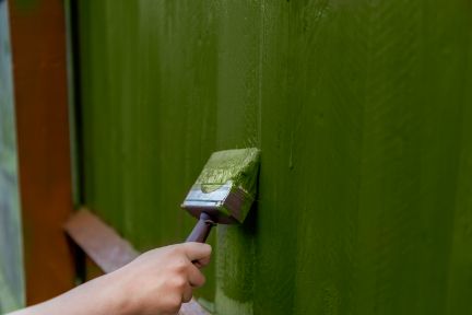Ongoing old fence restoration project in a residential property, including cleaning and fence painting in Townsville QLD.