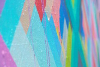 Wall with geometric paint design on a house painting project in Townsville QLD.