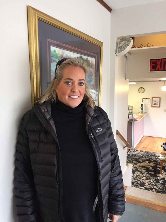 Happy Middle Aged Woman 2 Standing — Kennebunk, ME — Denture Solutions