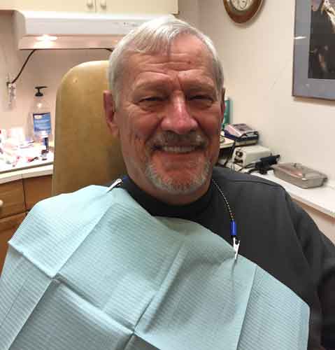 Happy Elderly Man 4 With Bib — Kennebunk, ME — Denture Solutions