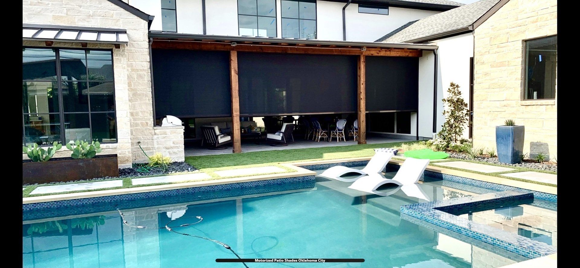 a picture of a house with a swimming pool and a motorized screened in porch