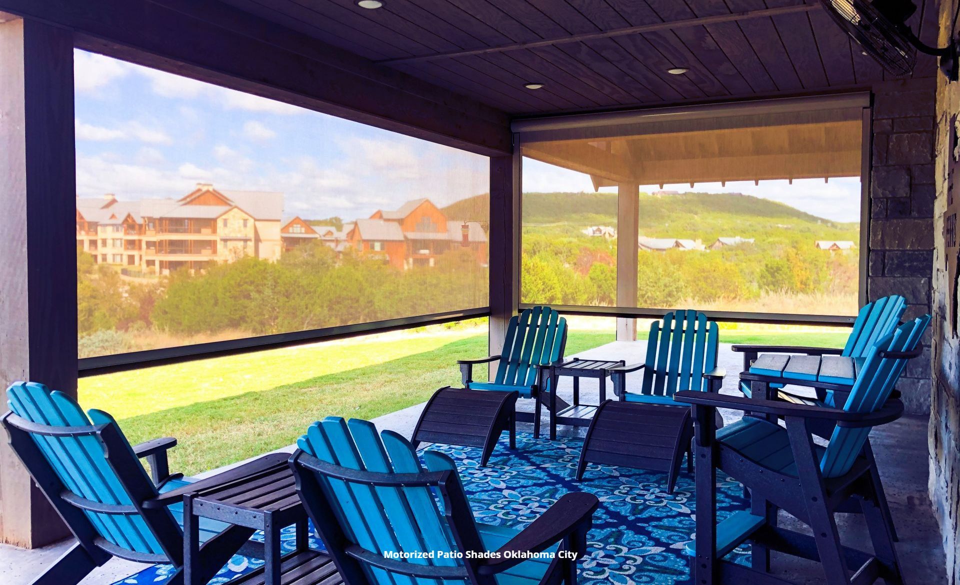 a screened in porch in oklahoma city with blue chairs