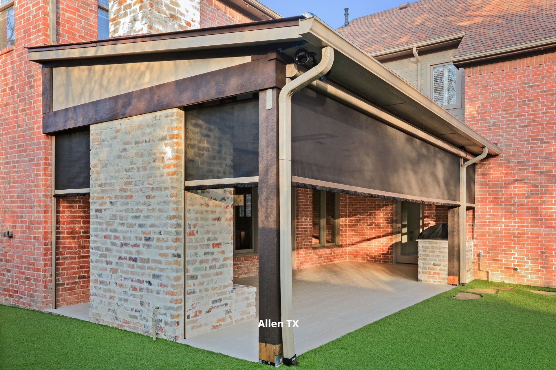 Shaded back patio with a motorized patio shade