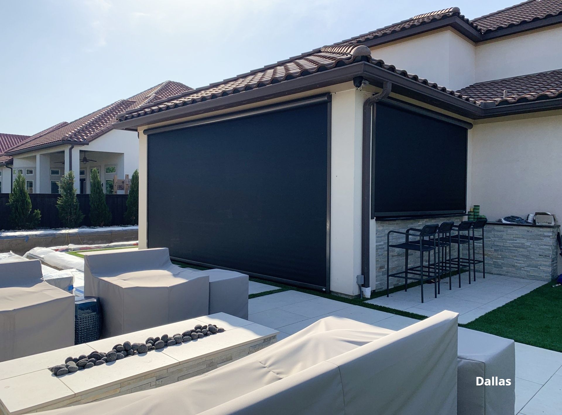 Retractable patio shade by a luxurious  deck
