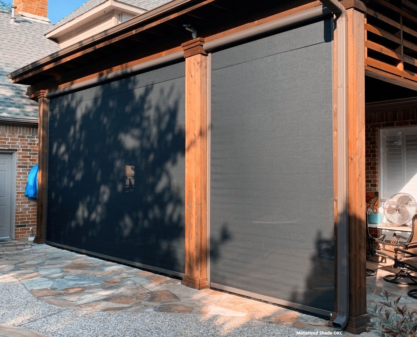 a picture of a screened in porch with a watermark that says motorized shade oc