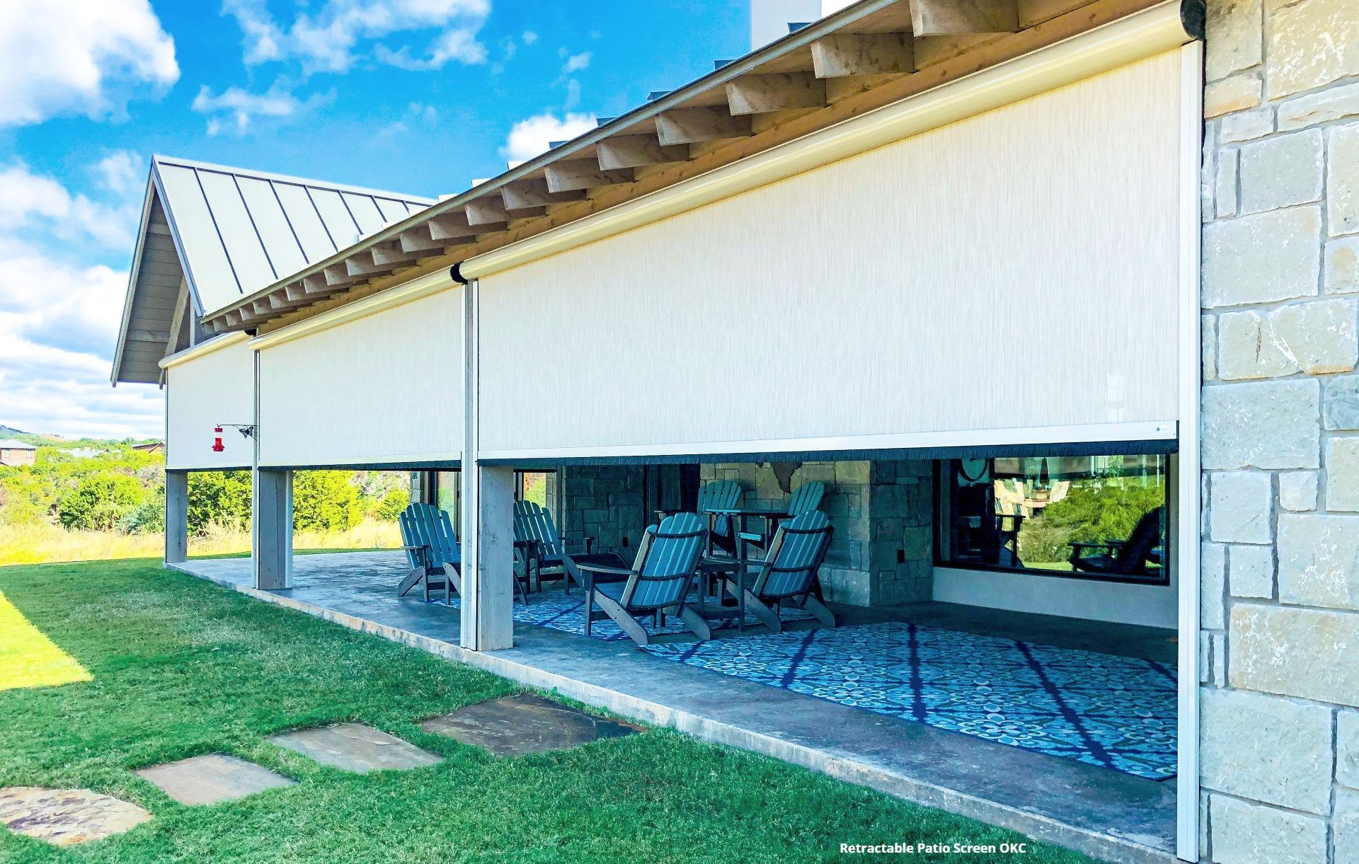 a retractable patio screen on the side of a house