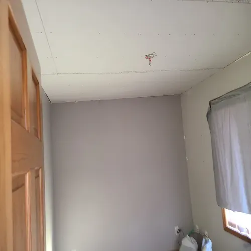 This photo showcases a professional gypsum board installation that we completed in Buffalo.