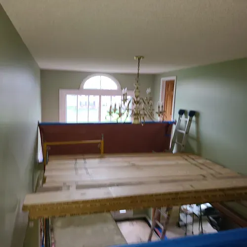 We take pride in our drywall services in Buffalo, including repairing cracks and holes, as seen in this photo.