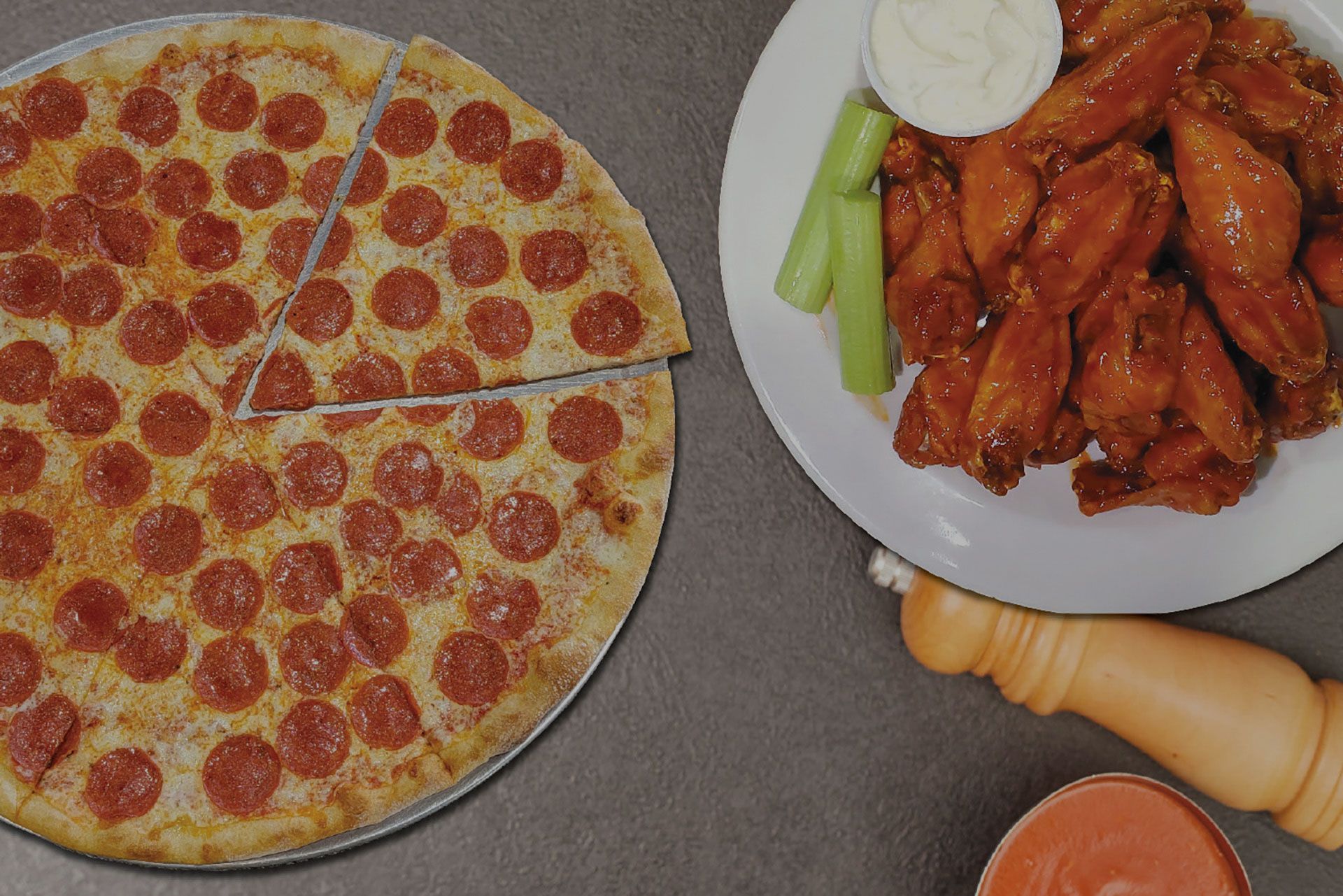 Pizza with pepperoni and cheese on a wooden board.