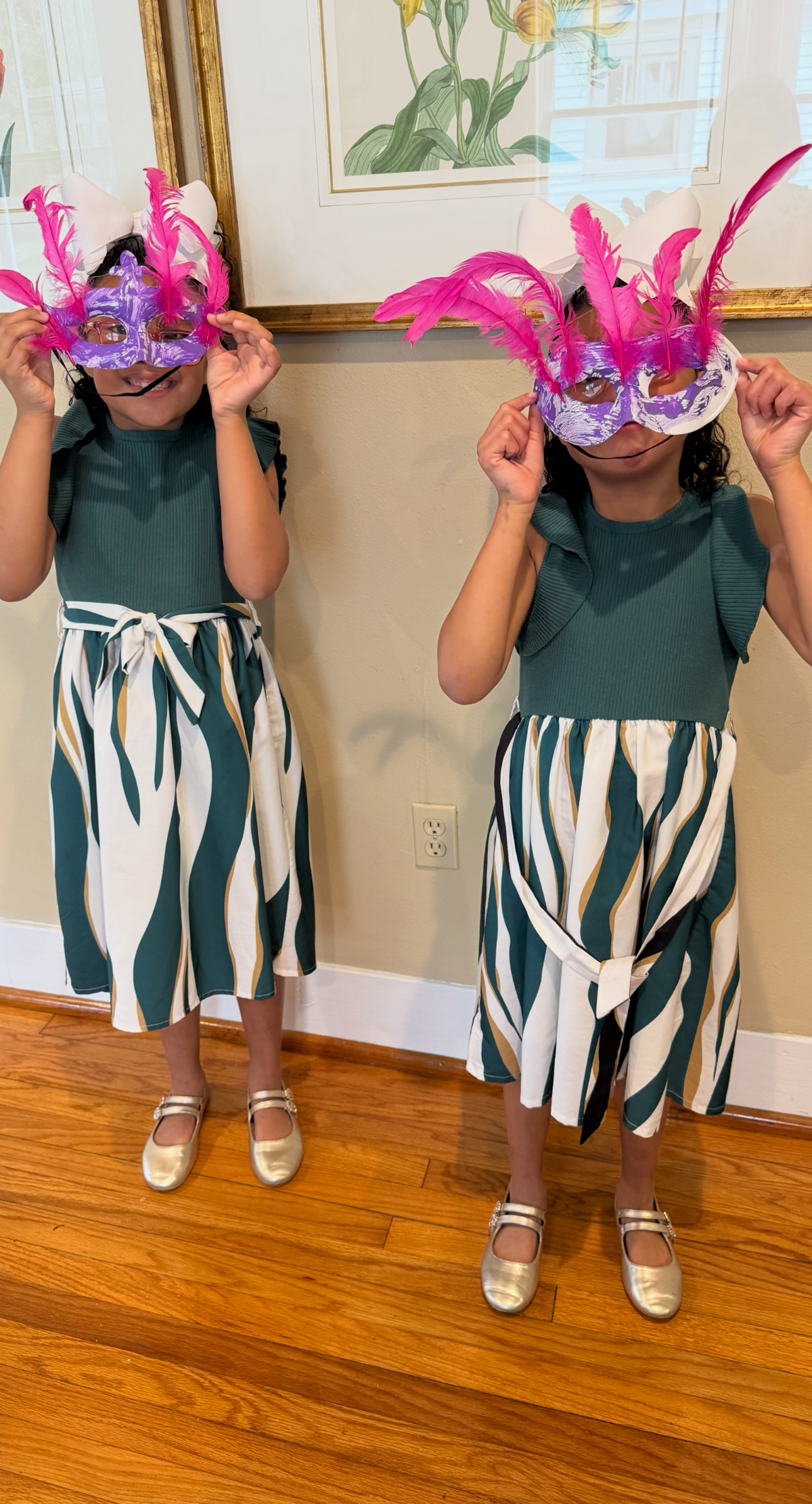 Students of Dr. Michelle Clare Benoit showing off their Mardi Gras Masks