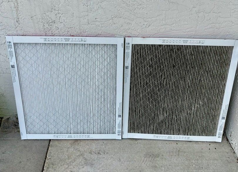 Two HVAC air filters side-by-side: clean and white vs. dirty, black with trapped particles.