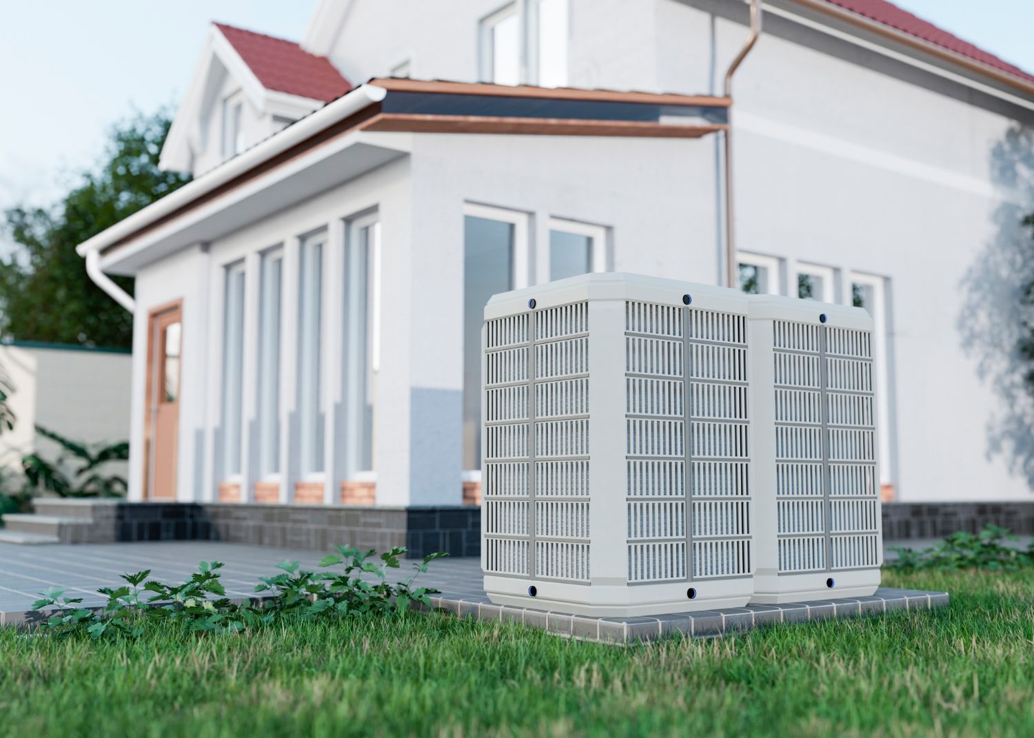 A white house with a large air conditioner in front of it.