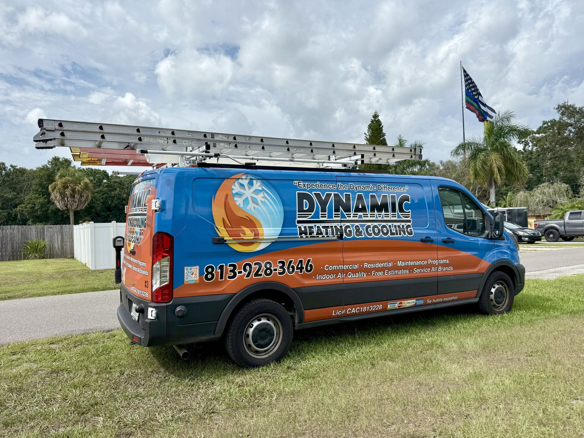 A blue and orange van with the company name 