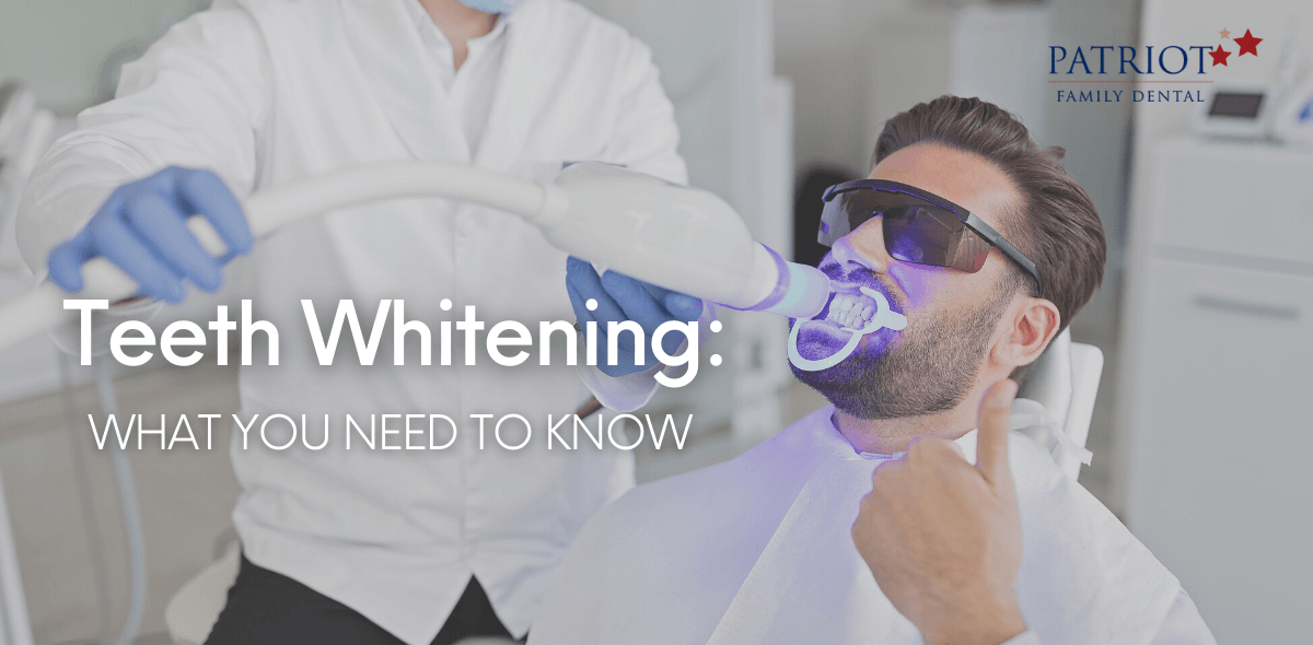 Dentist using LED light to whiten patient's teeth
