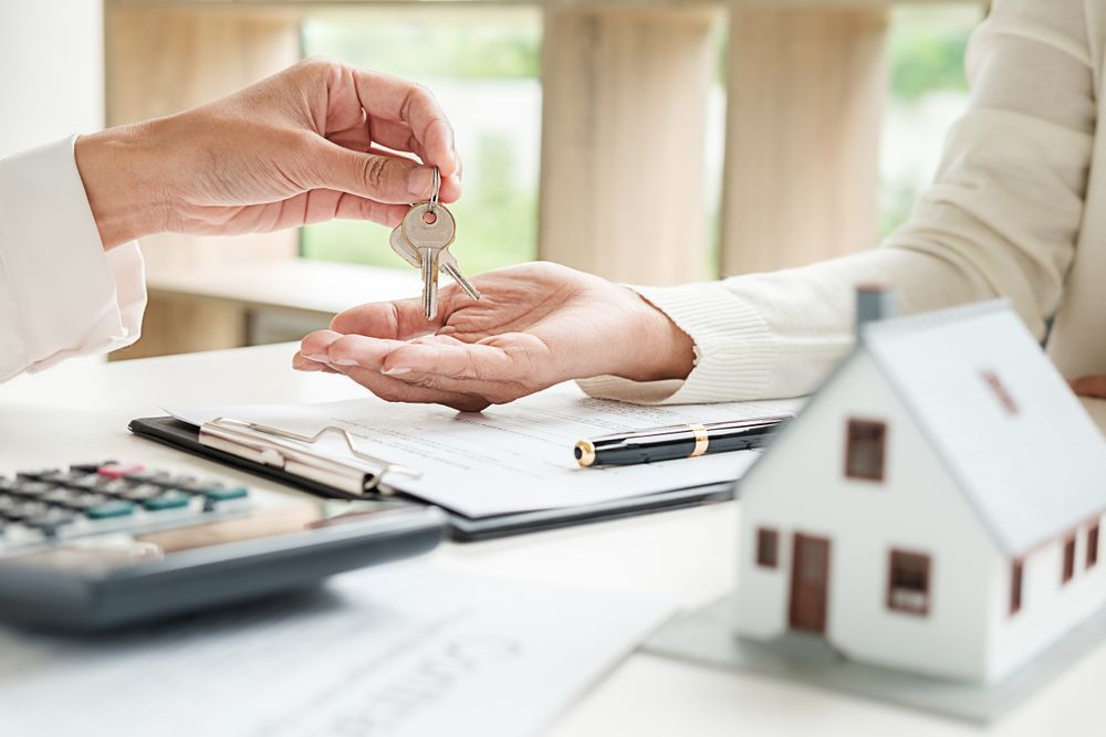 Handing Over House Keys — Adamson Legal & Conveyancing in Wingham, NSW