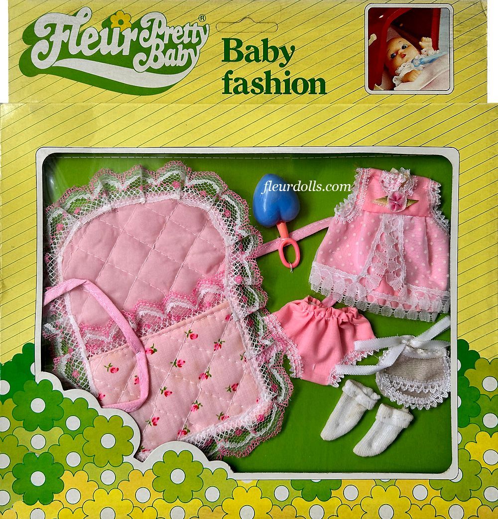 Fleur doll Pretty Baby Fashion box for a girl including a pink carry bag, dress, shoes and rattle.