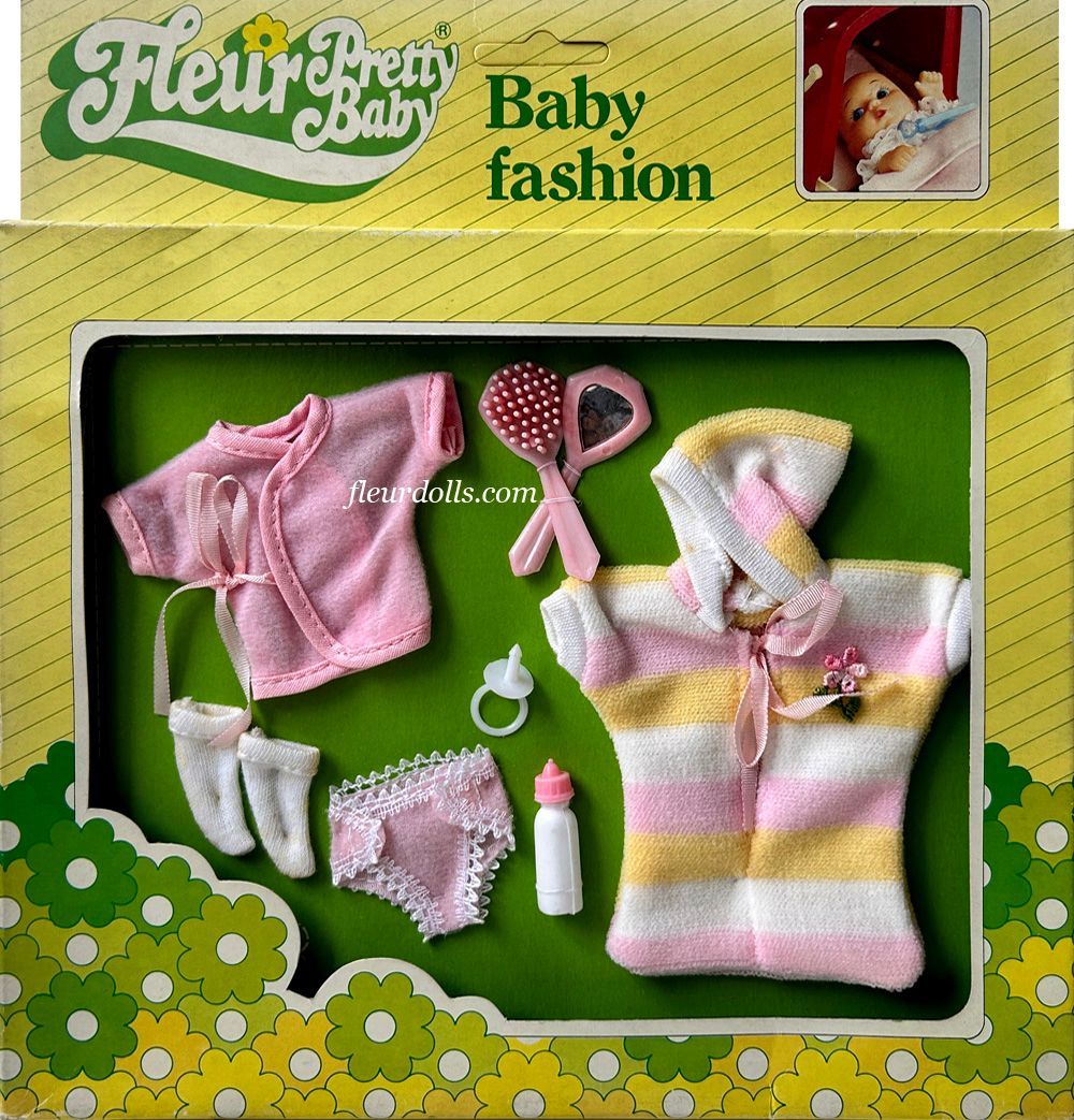Fleur doll Pretty Baby Fashion box for a girl with white-pink-yellow bunting bag, wrap shirt, underwear, socks, milk bottle and hair accessories.