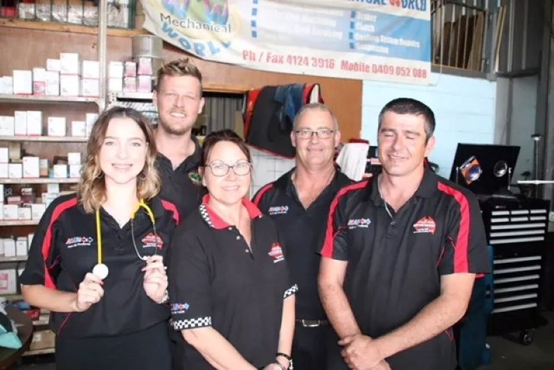 A Group of People Posing for A Picture in A Store — Radiator Doctor In Pialba, QLD