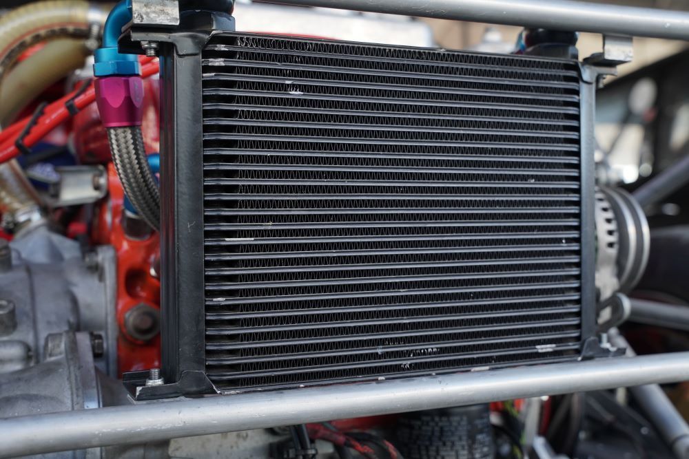 A Close up Of a Radiator on A Car Engine — Radiator Doctor In Pialba, QLD