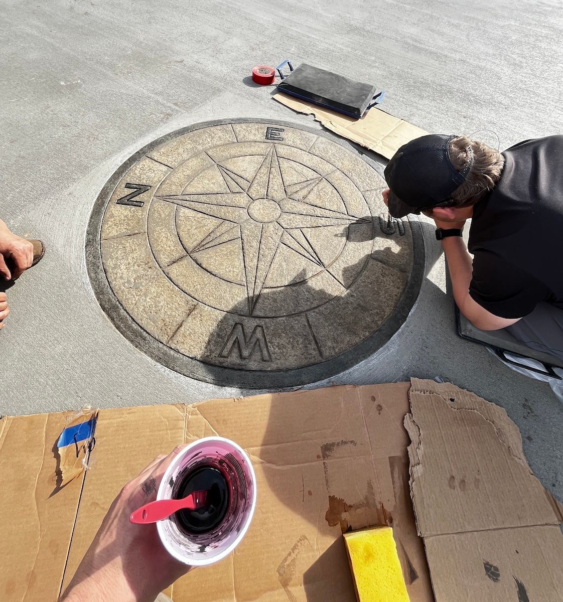 Custom compass rose decorative concrete driveway in Columbia, SC — hand-detailed stamped concrete installed by Duffie Driveway Solutions