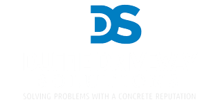 A blue logo with the letters "DS" above the text "SOLVING PROBLEMS WITH A CONCRETE REPUTATION."