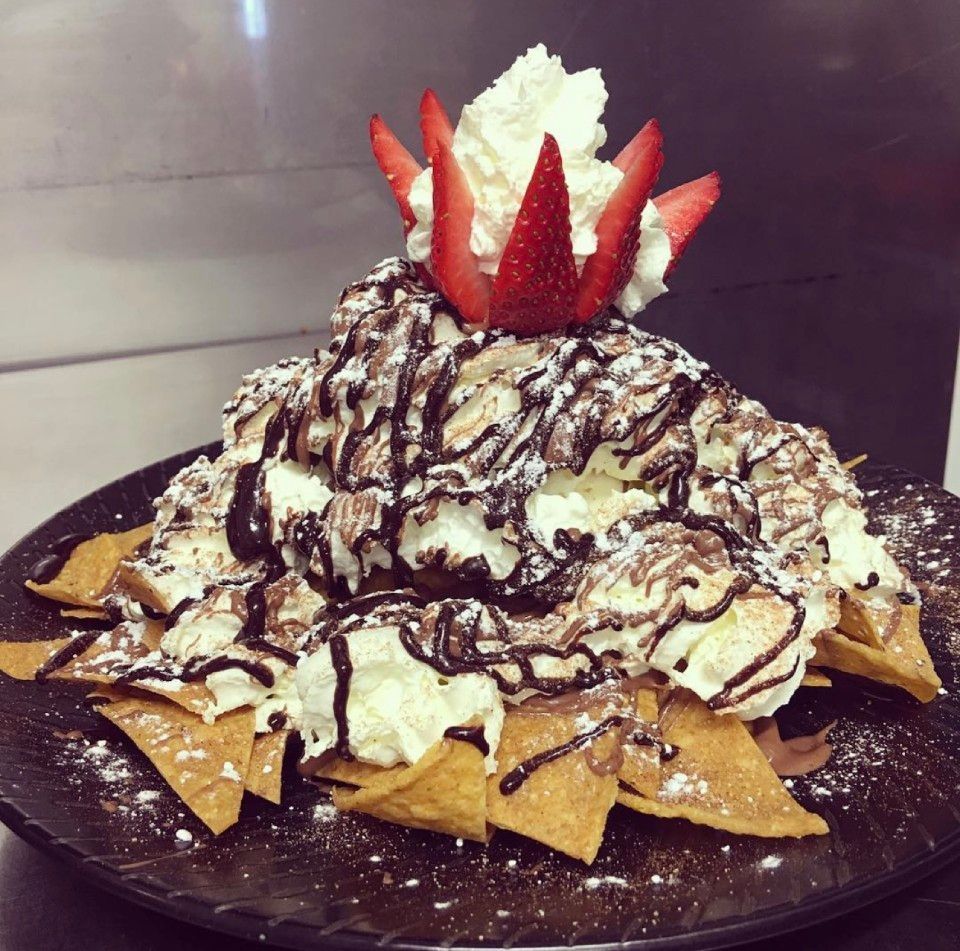Chocolate dessert nachos: tortilla chips topped with whipped cream