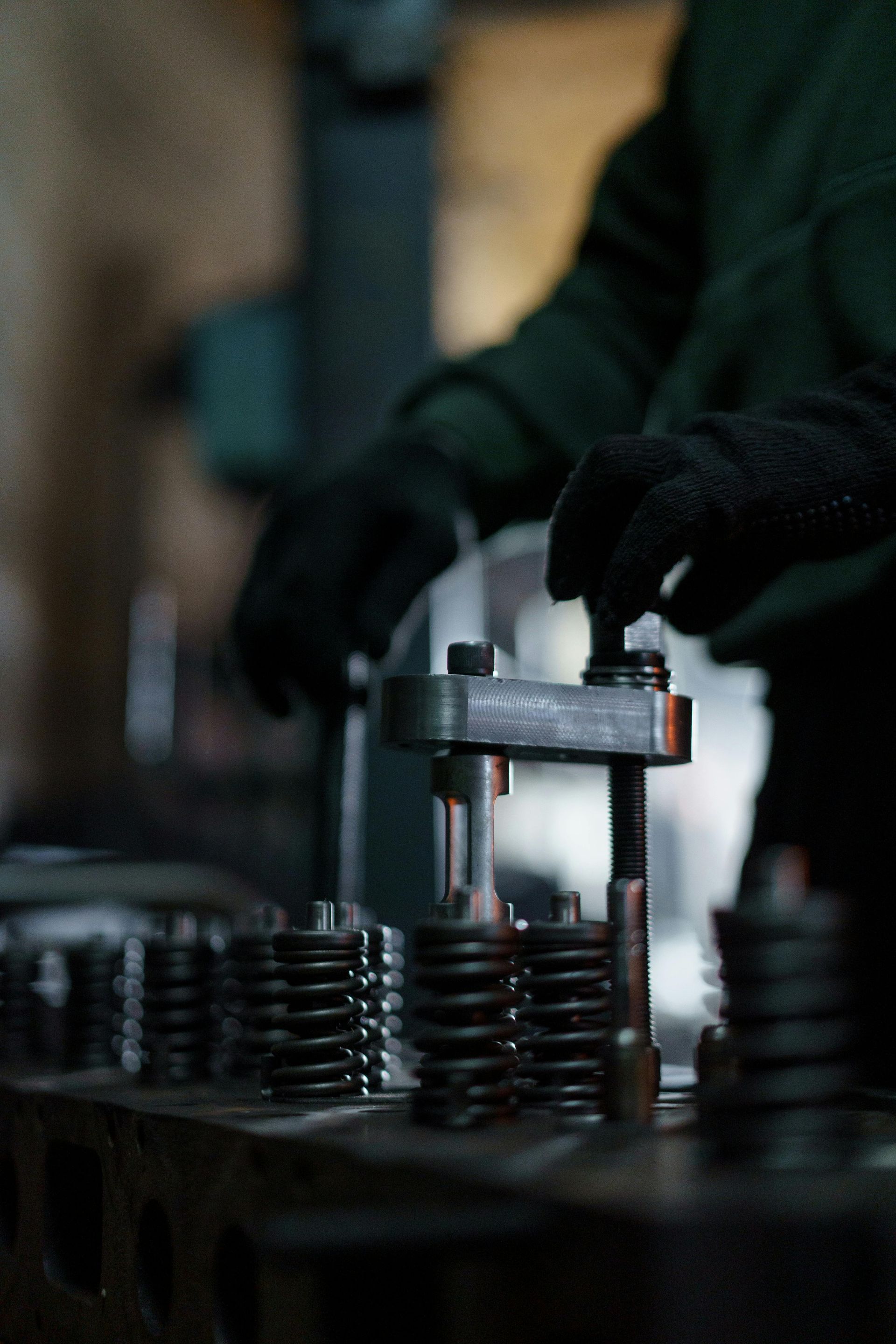 A person is working on a machine in a factory.