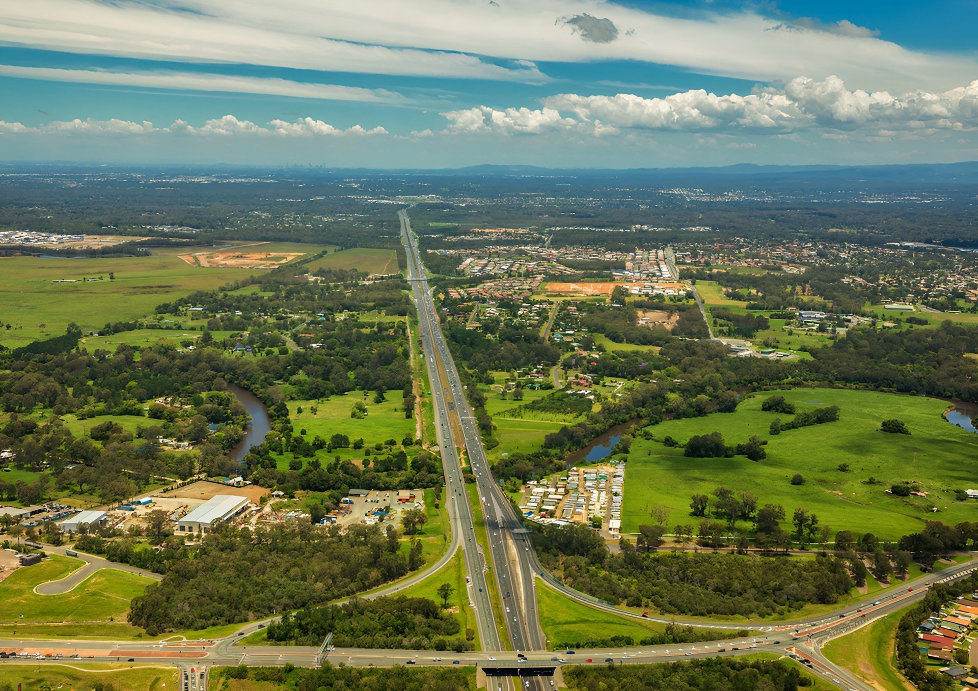 An Aerial View of A Highway Surrounded by Trees and Fields — Al Roberts Education Centre in Wynnum West, QLD