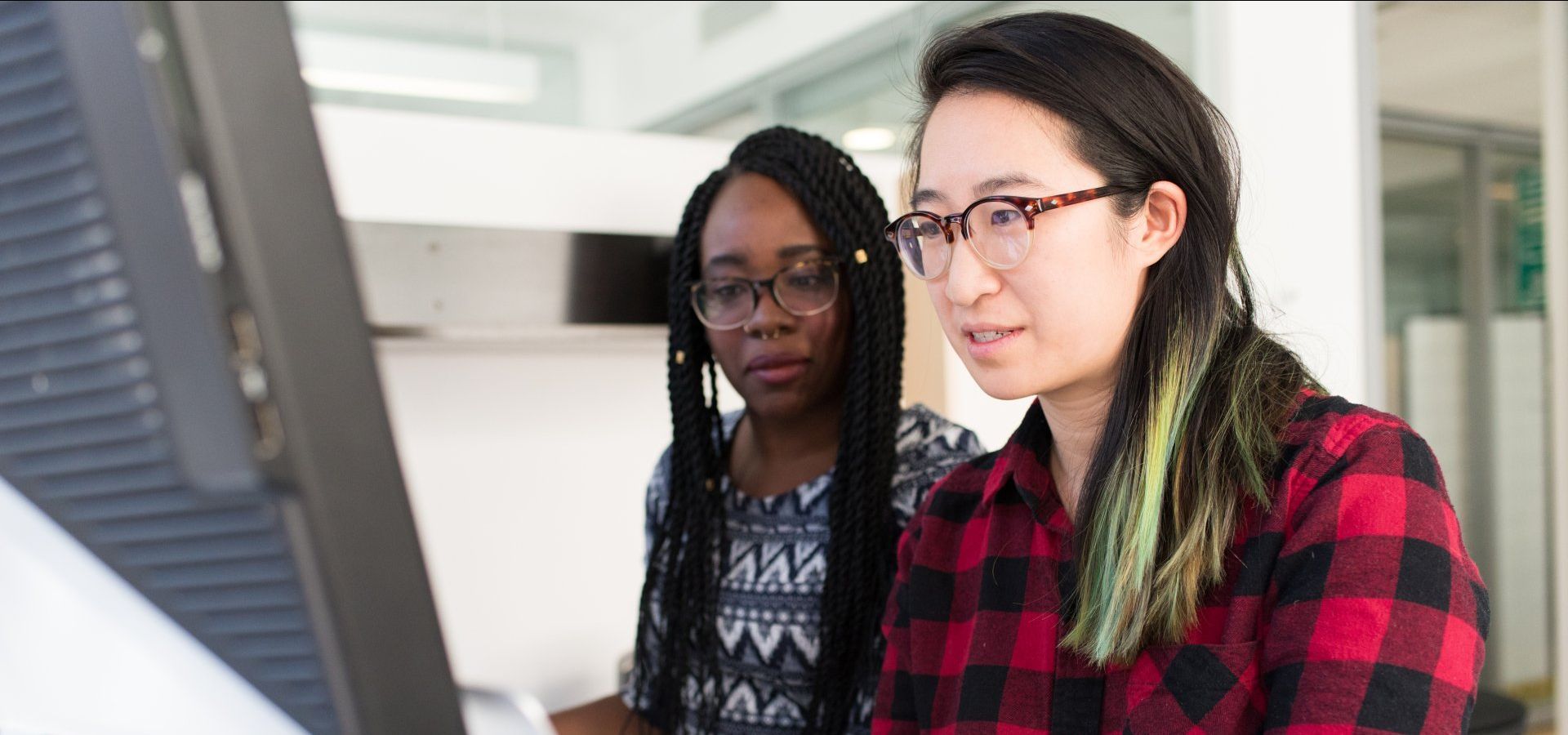 Colleagues viewing a screen together
