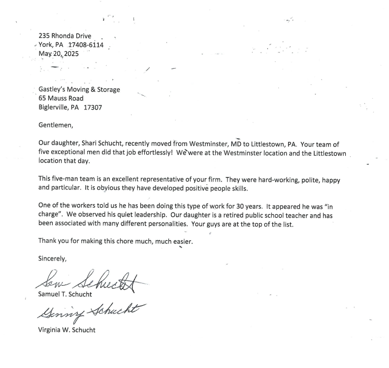 A black and white letter with a signature on it.