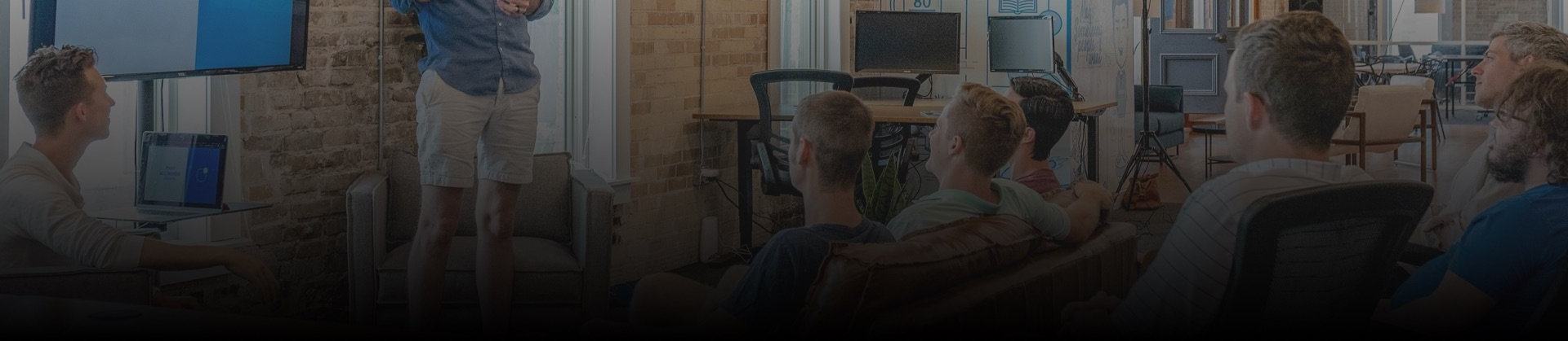 Whiteboard with yellow sticky notes; planning meeting concept.