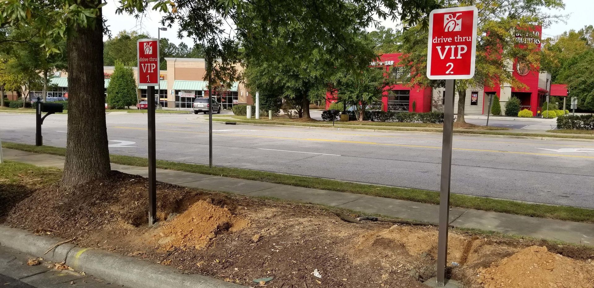 A stop sign on the side of a road