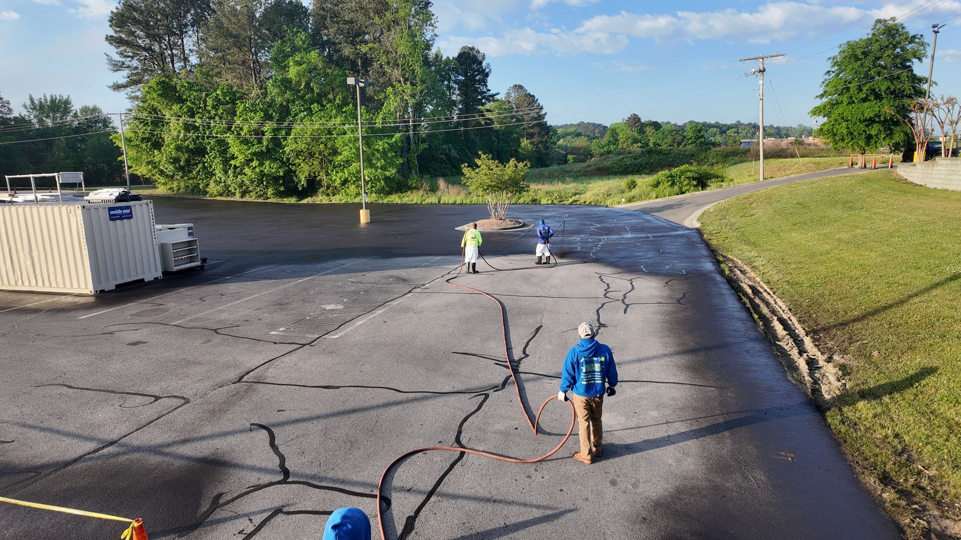 A group of people are walking down a road.