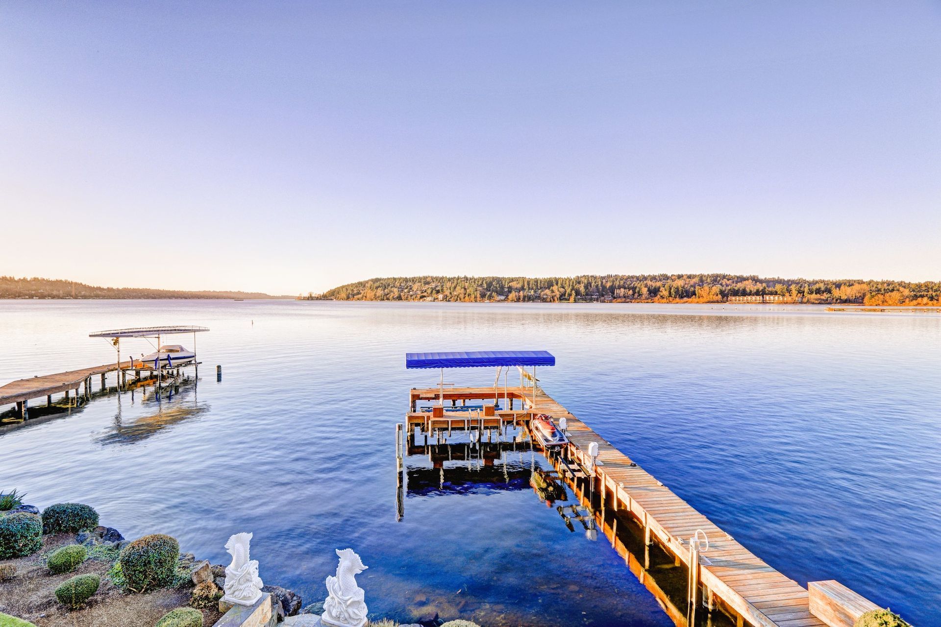 Top view of a private waterfront dock with jet ski and boat lifts in Tampa, FL