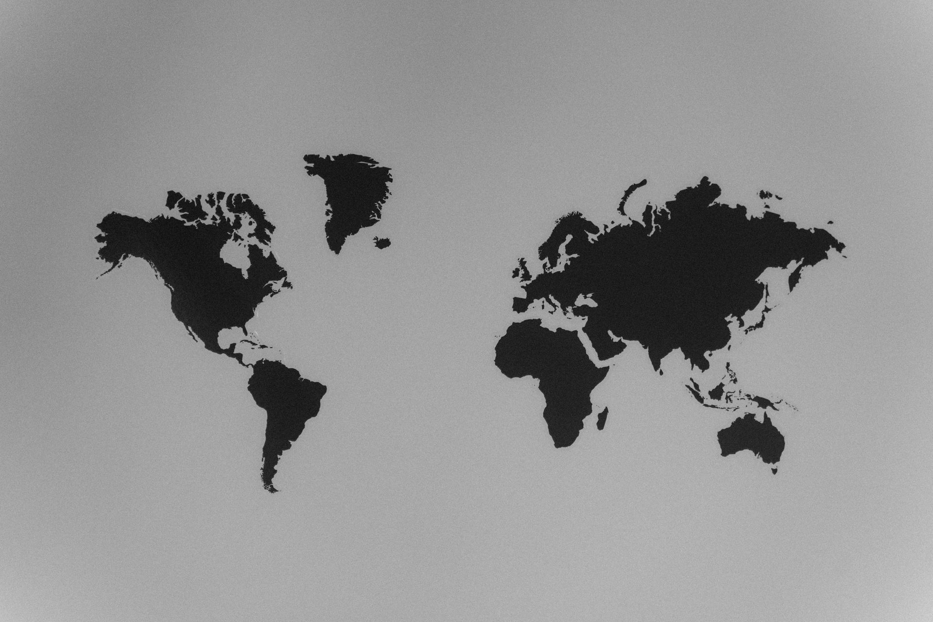 A black and white map of the world on a white background