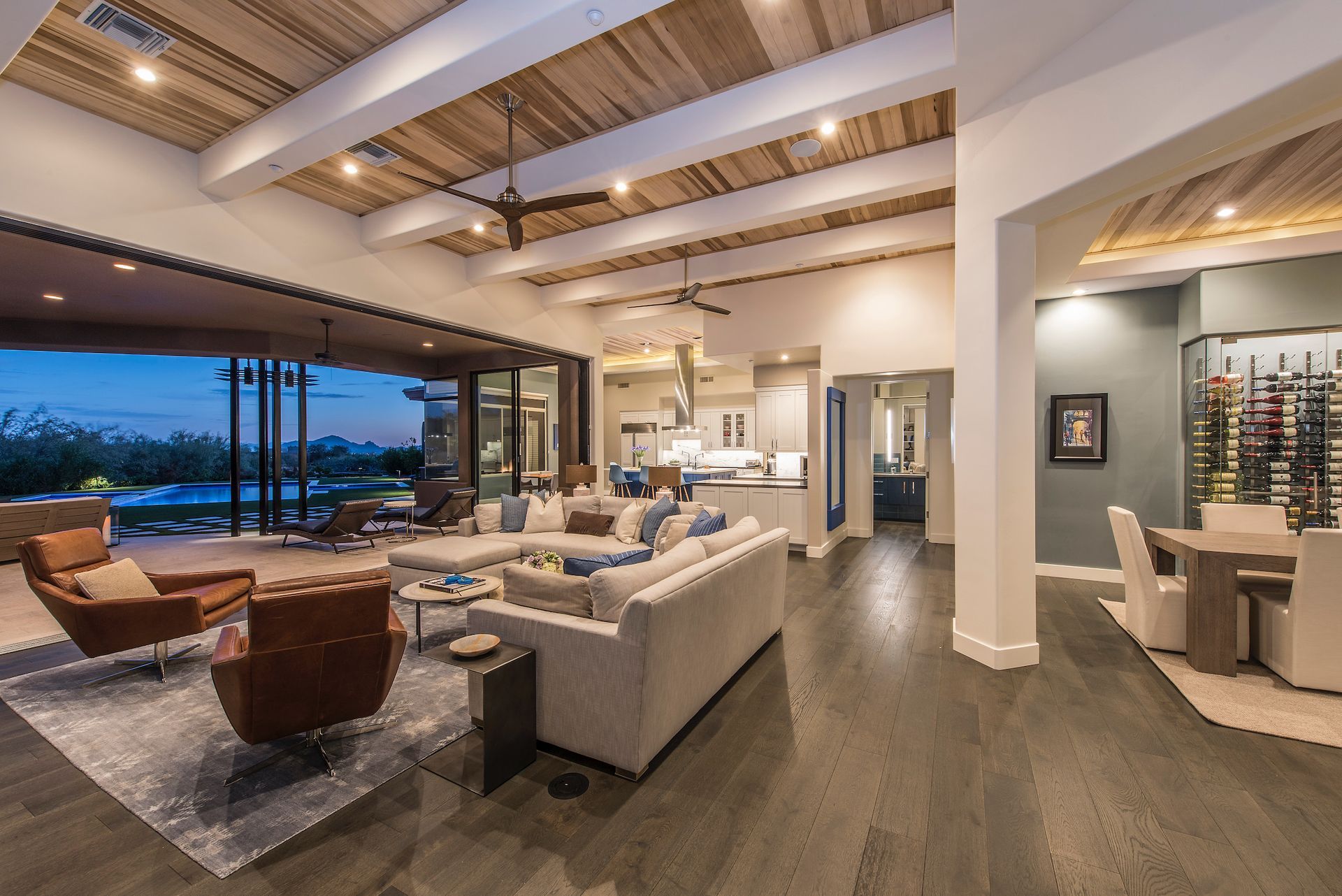 A living room with a couch , chairs and a table