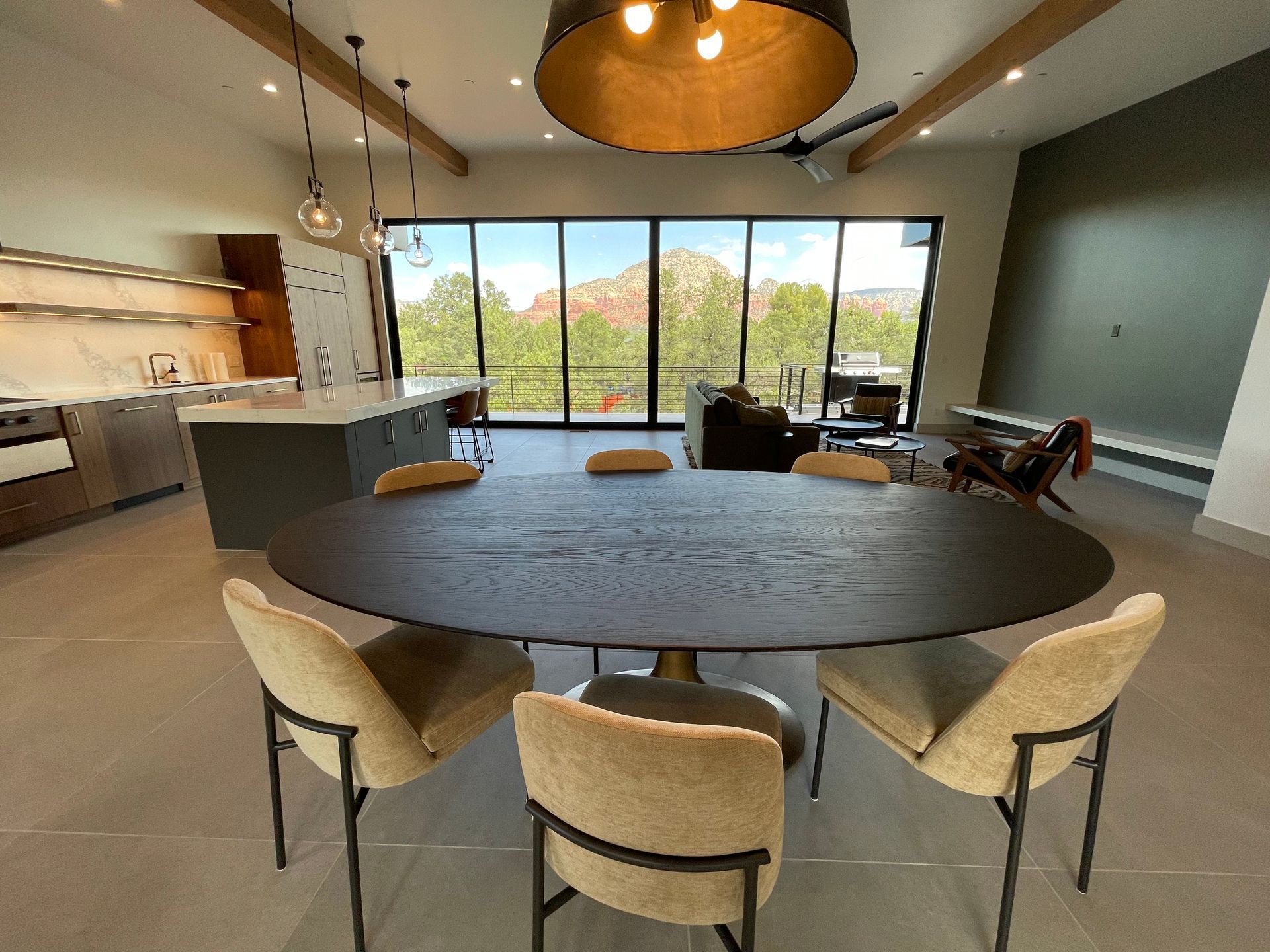 There is a table and chairs in the middle of the room.