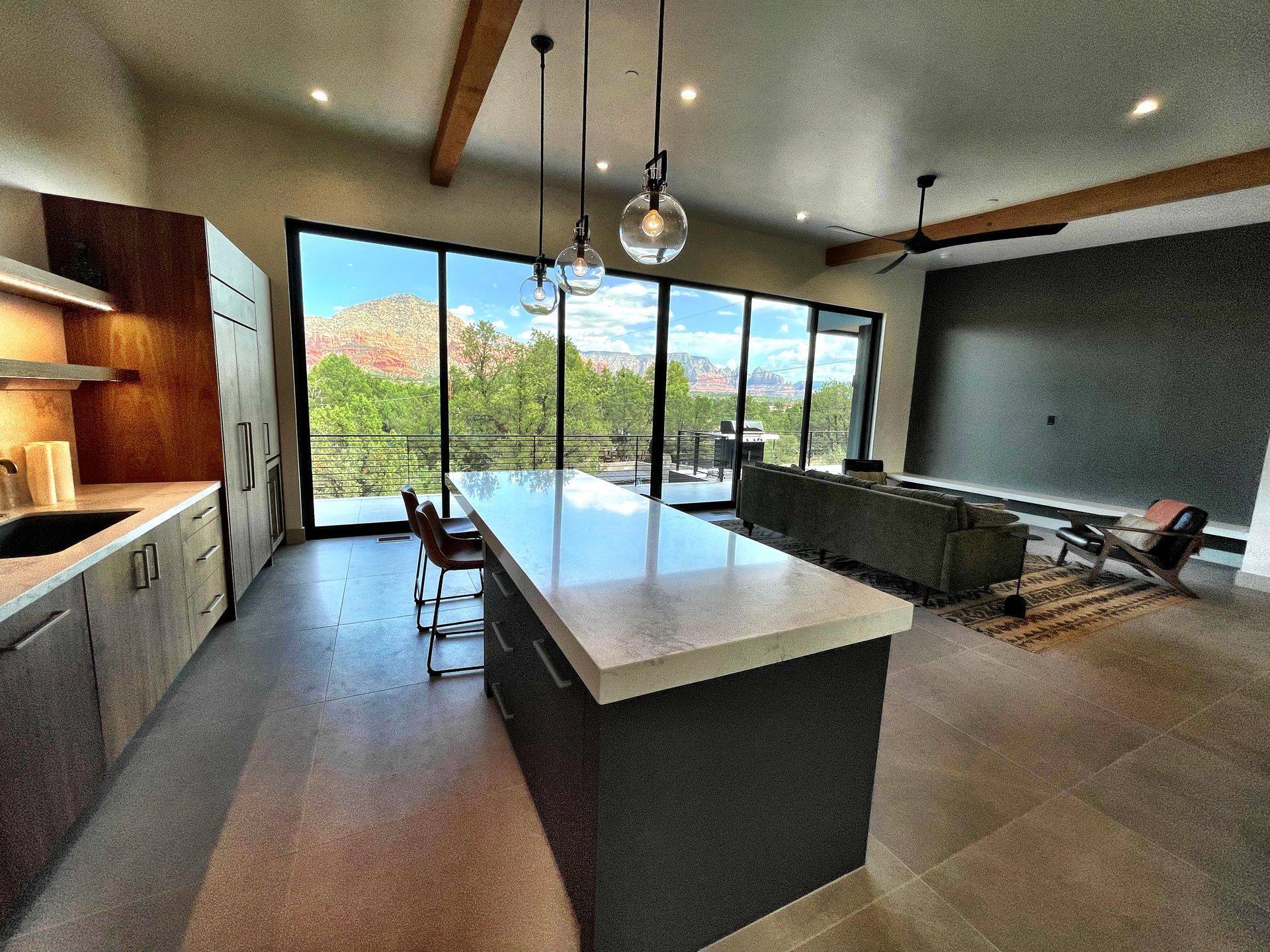 A kitchen with a large island in the middle of the room.