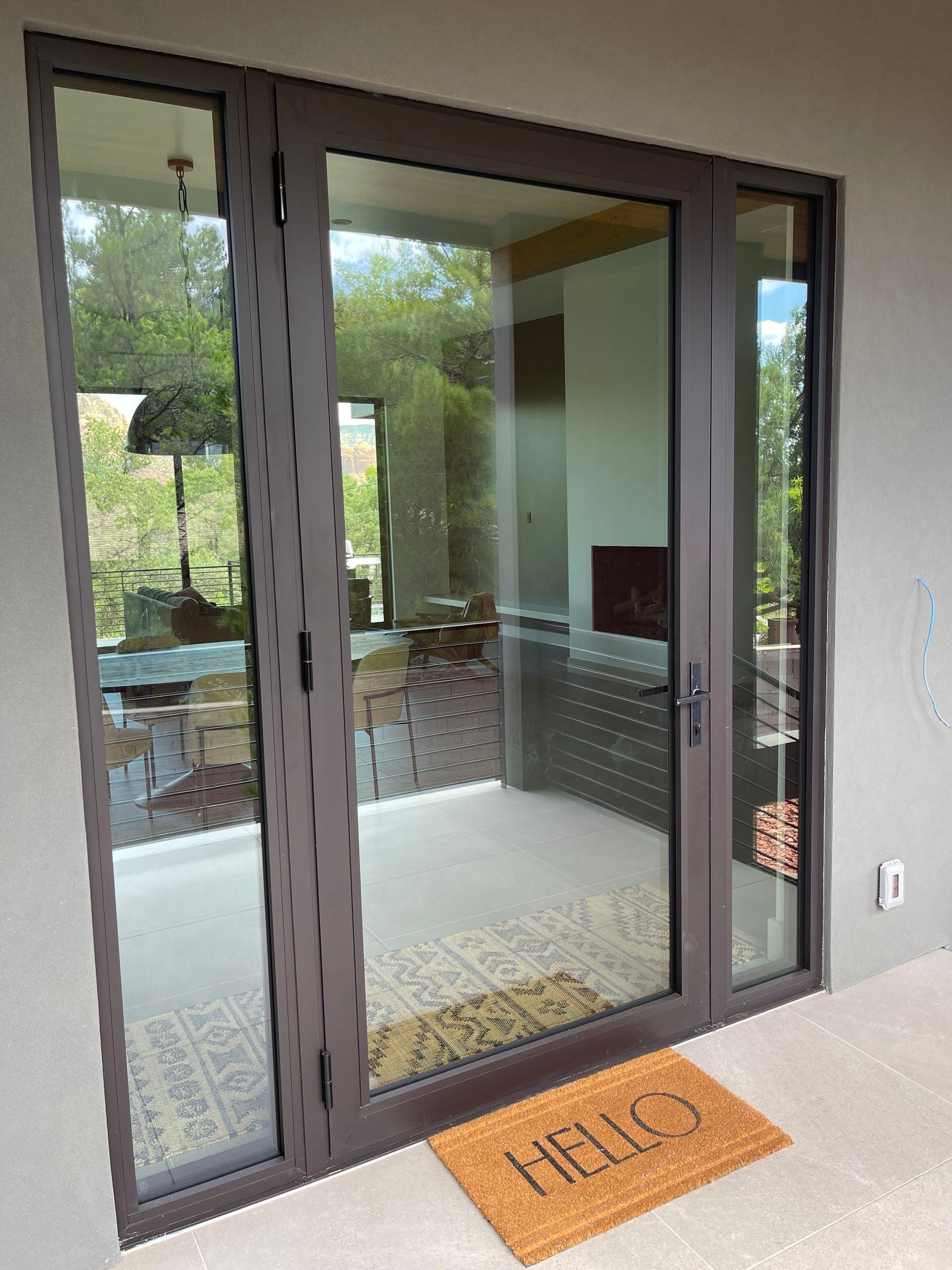 A door with a mat that says hello on it