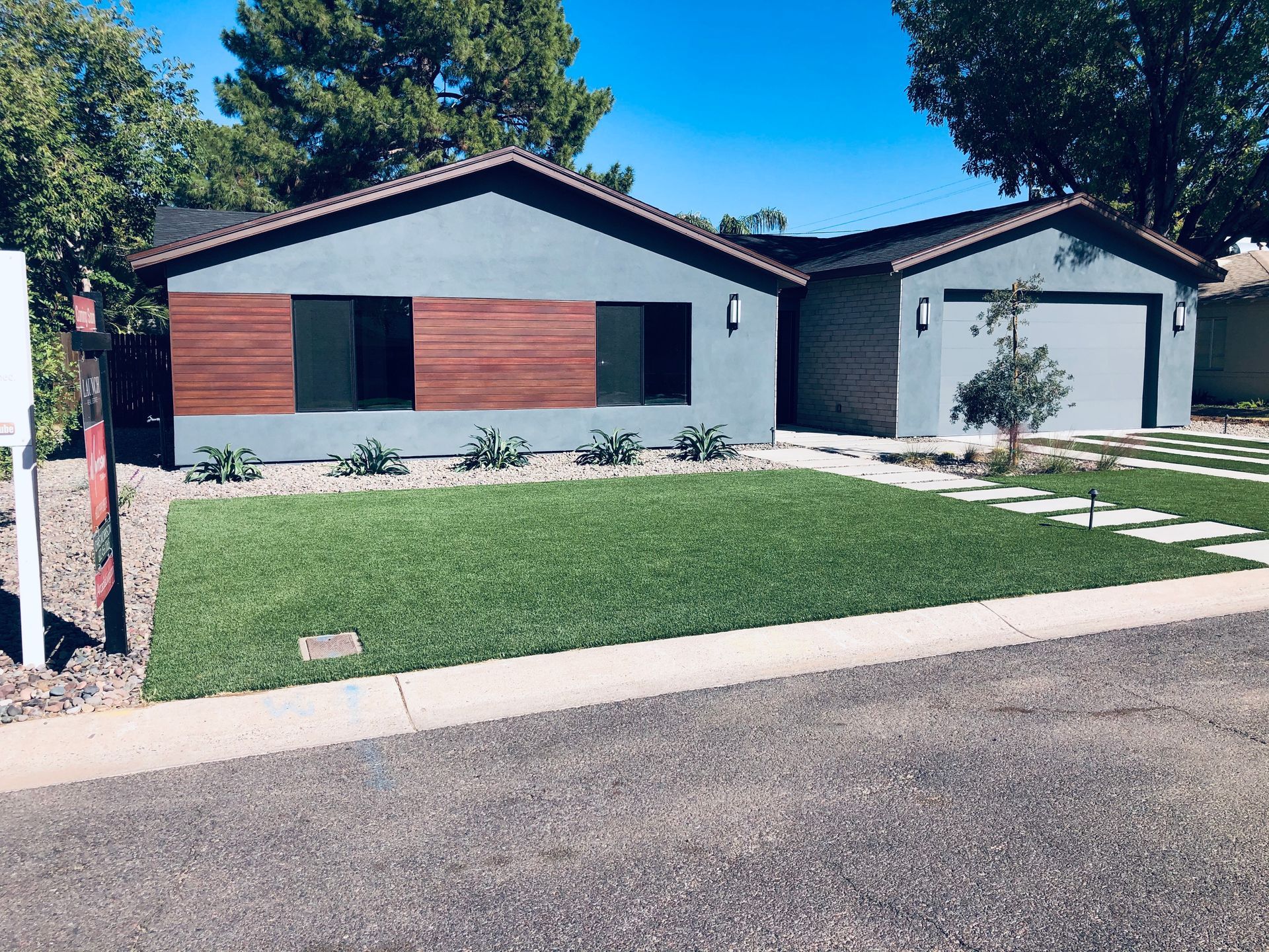A house with a lot of grass in front of it