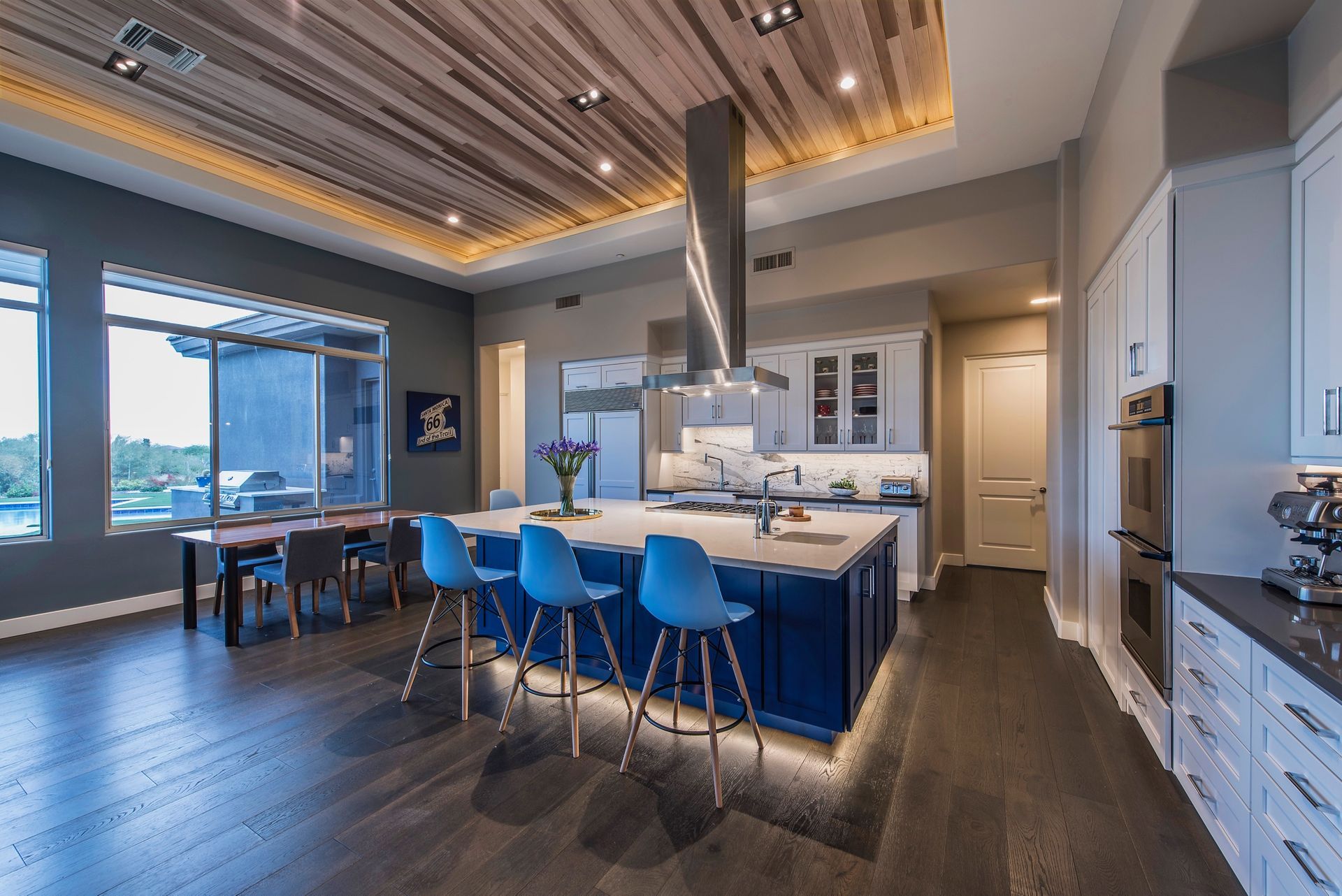 A kitchen with a large island in the middle of the room.