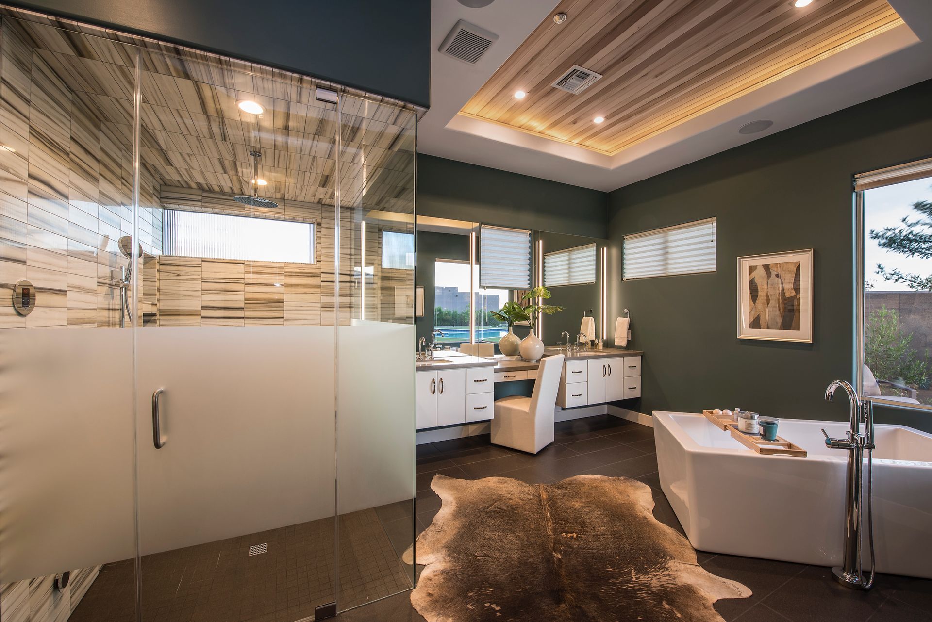 A bathroom with a bathtub , sink , and shower.